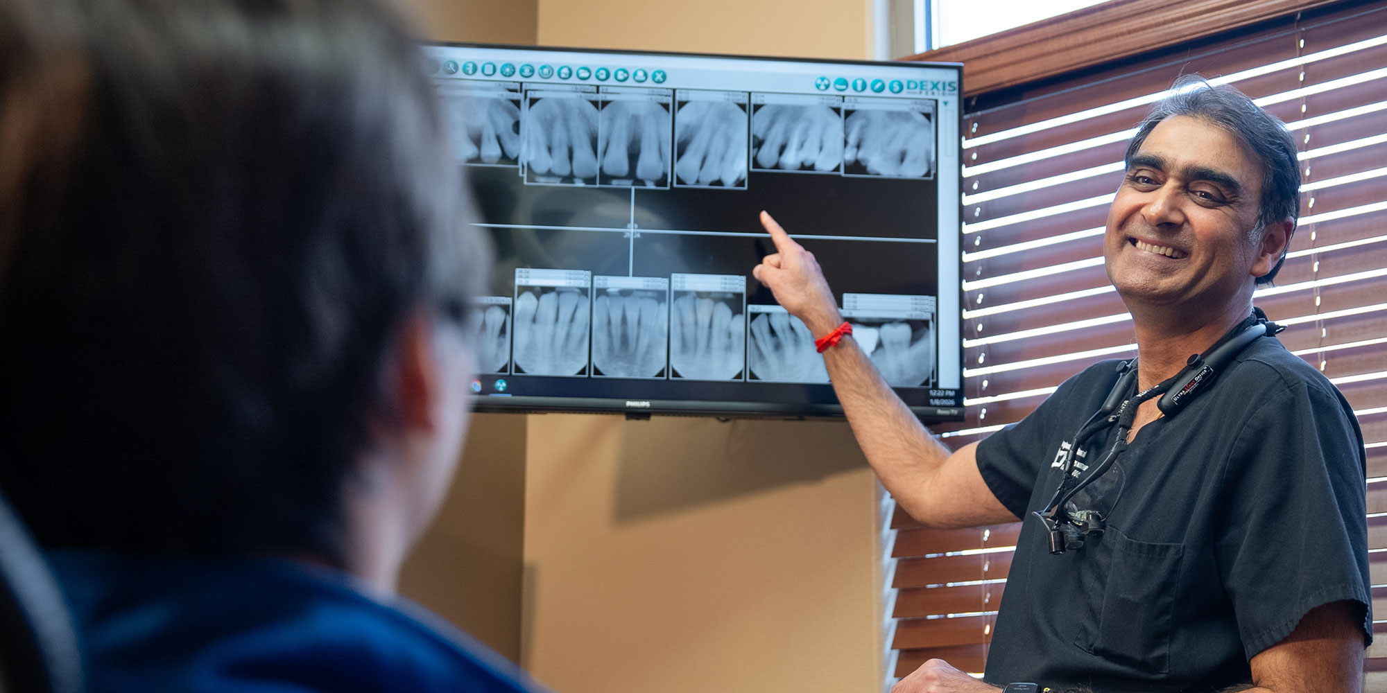 doctor going over dental procedure information with patient