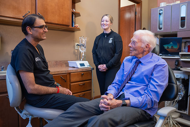 patient and doctor going over dental procedure information