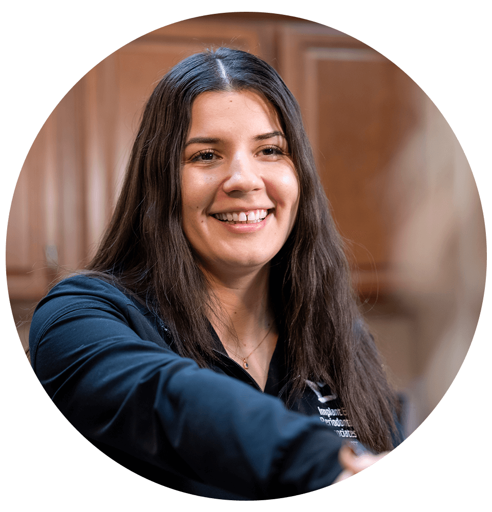 staff member helping with dental patient at the front desk