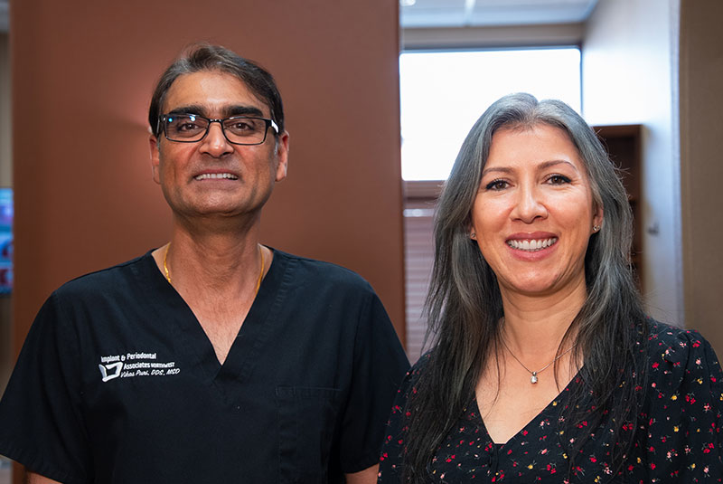patient and doctor smiling brightly after patient's dental procedure