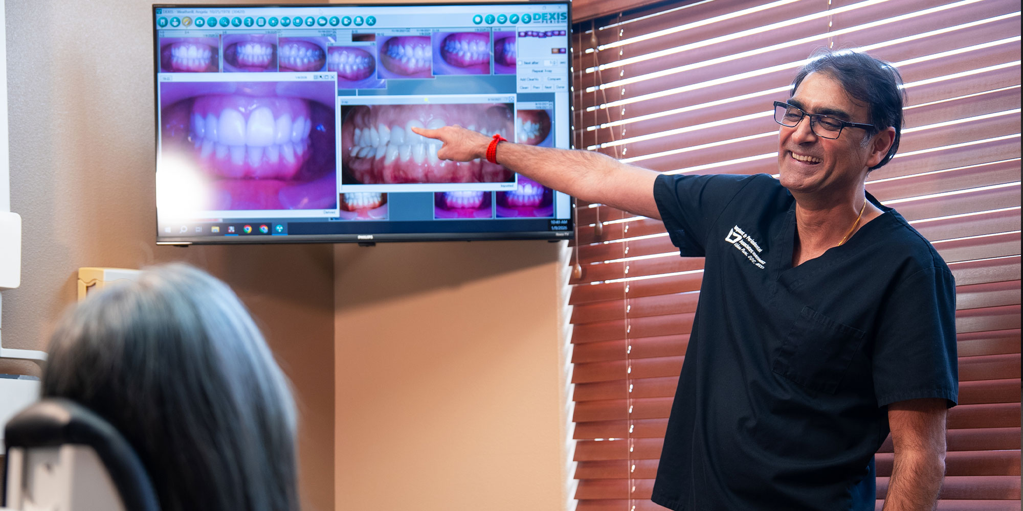 doctor going over dental procedure information