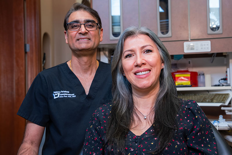 patient and doctor both smiling brightly after dental treatment