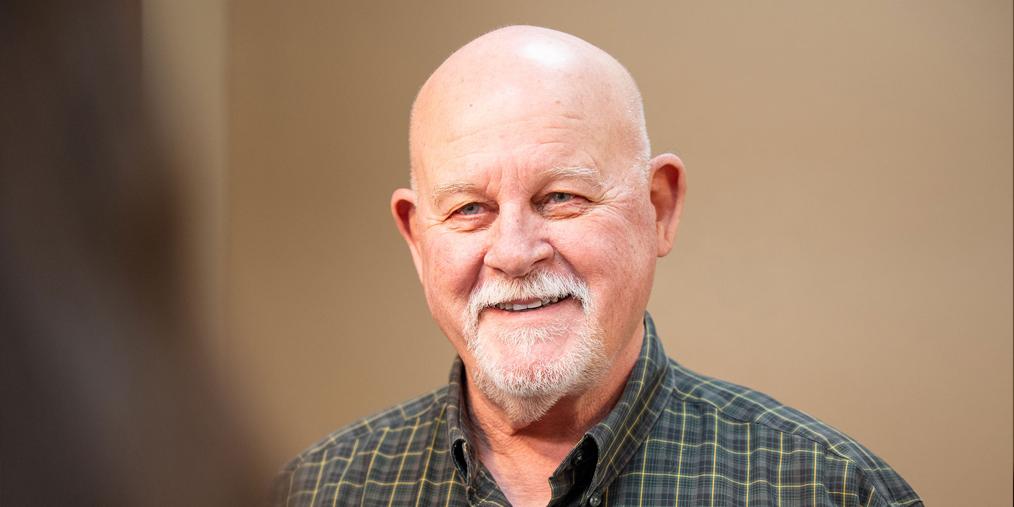 headshot of dental patient at the front desk