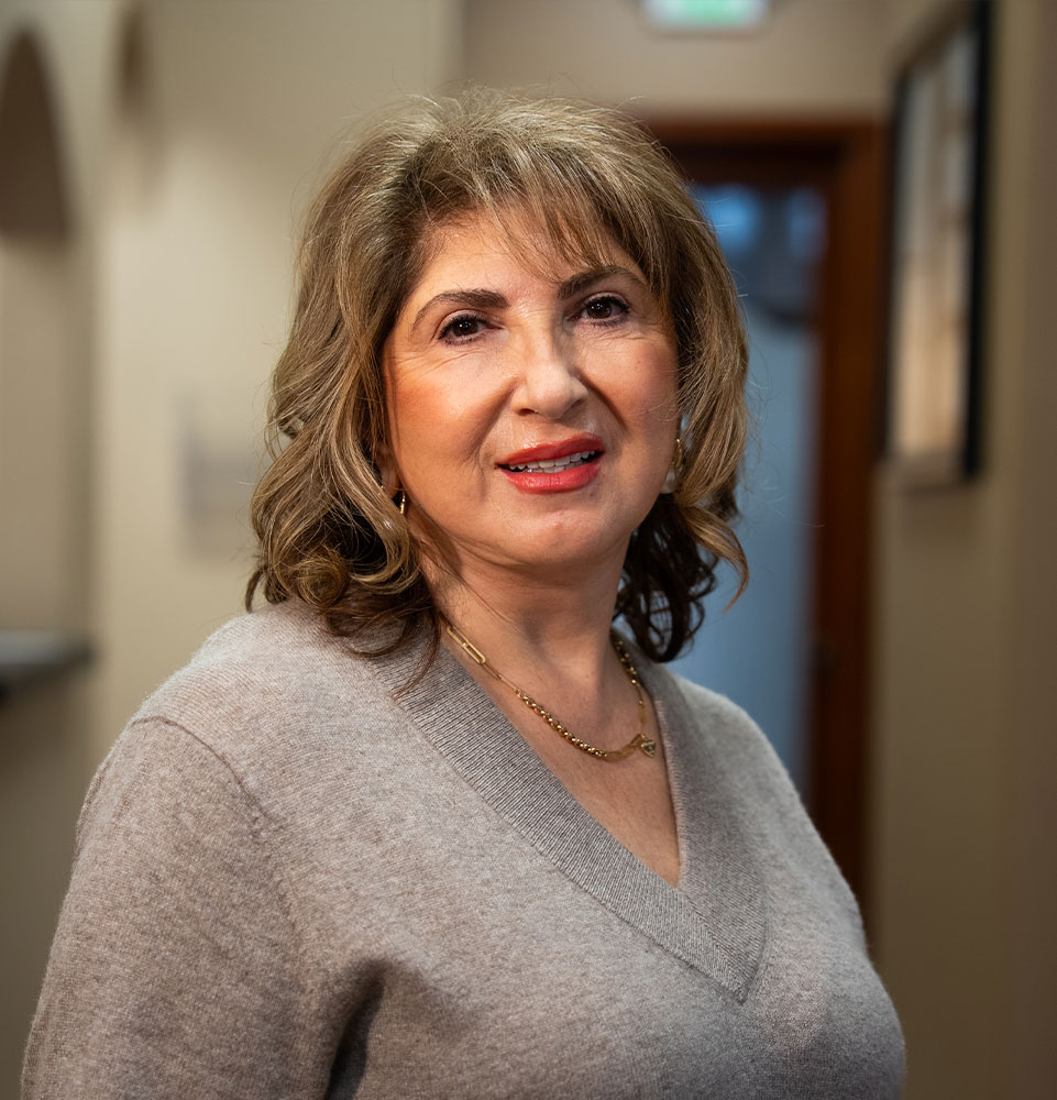 headshot of patient smiling brightly